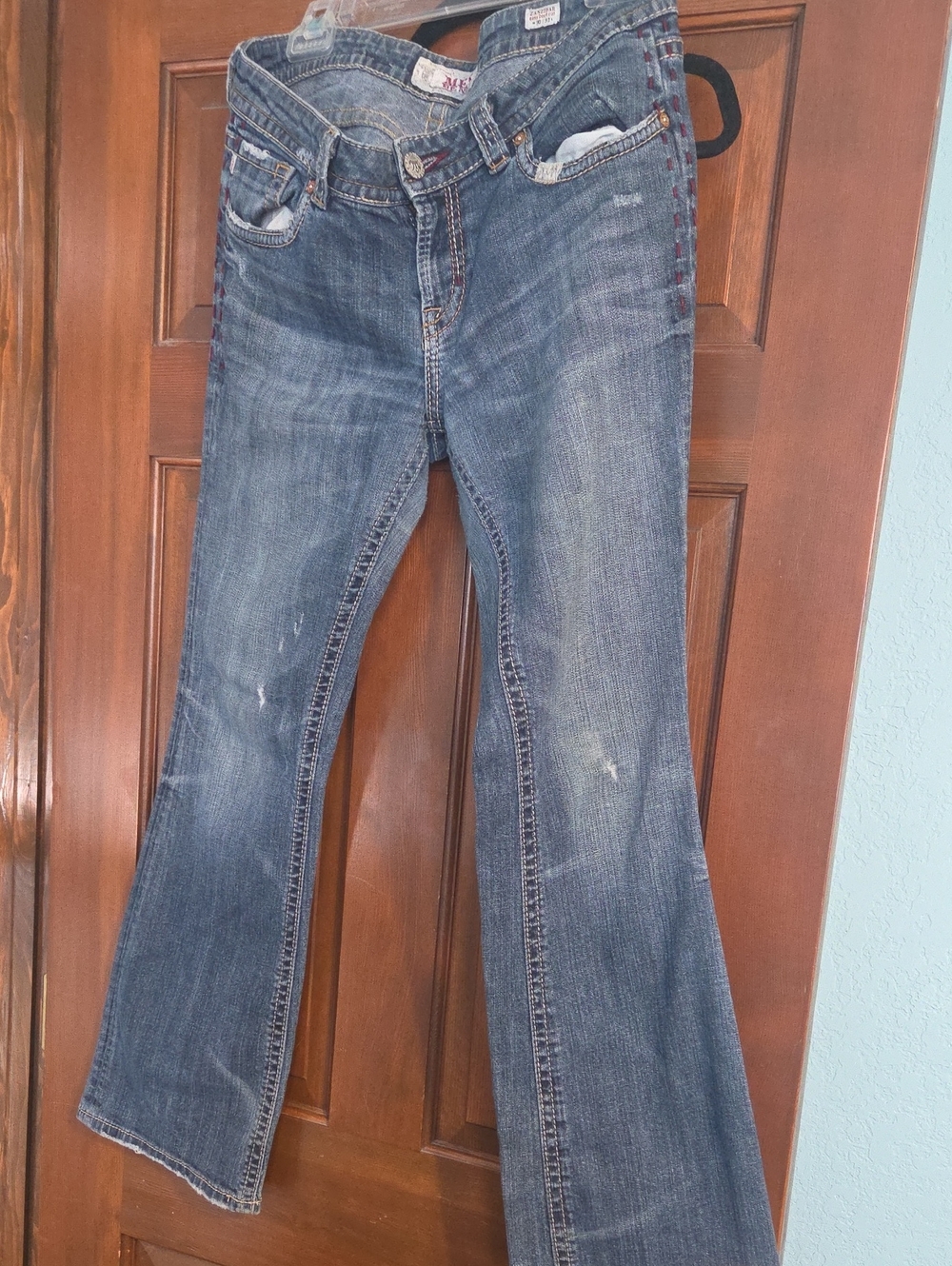Women’s Blue Flare Jeans with Subtle Distressing